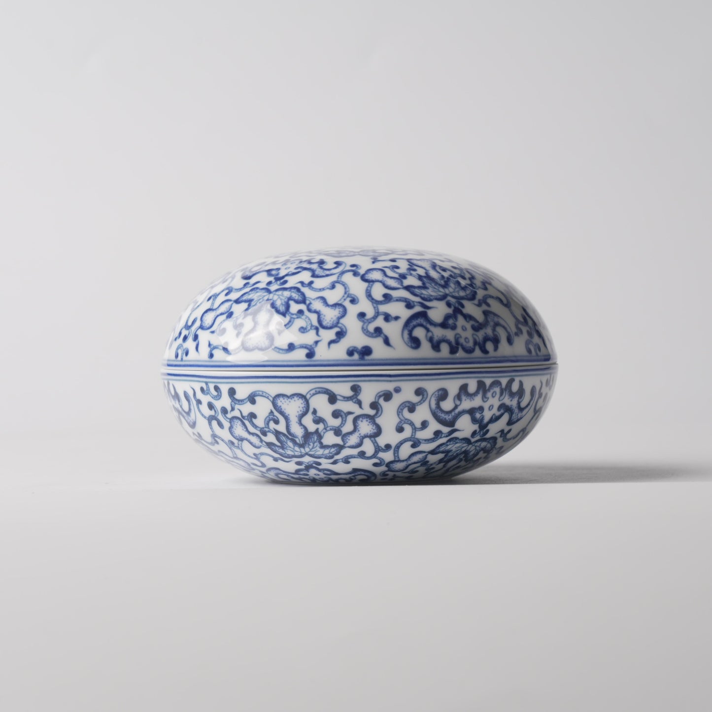 Fu Lu — 6" Blue & White Lotus Scroll Oval Covered Jar